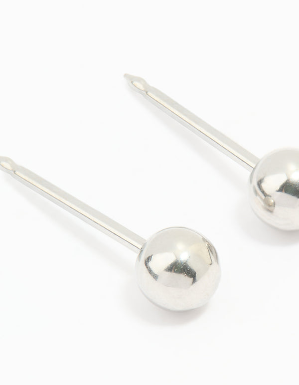 Showcasing 4MM ball piercing studs crafted from surgical stainless steel in silver with stud closure close up view