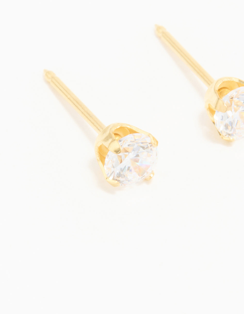 Elegantly designed 24K gold plated surgical stainless steel 4MM cubic zirconia piercing stud with clear accents close up view