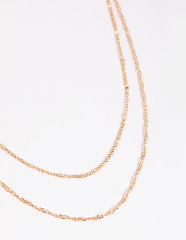 Discover a gold twisted layered necklace close up view