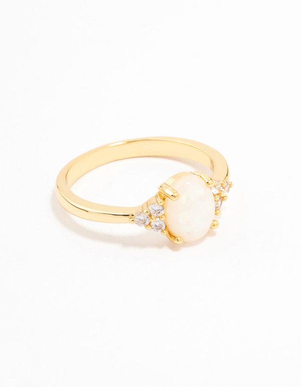 Showcasing a gold plated mystical oval ring with dainty styling and ivory white stones side detail view