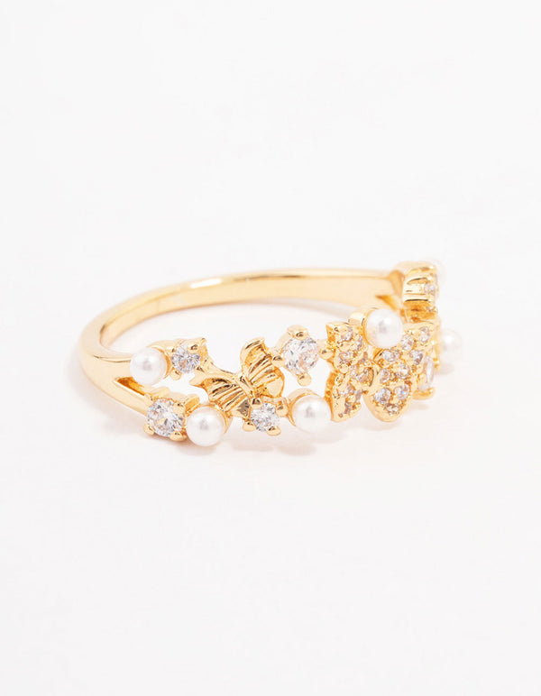 Delicately crafted butterfly pearl band ring in gold plated metal with cubic zirconia and dainty styling front view