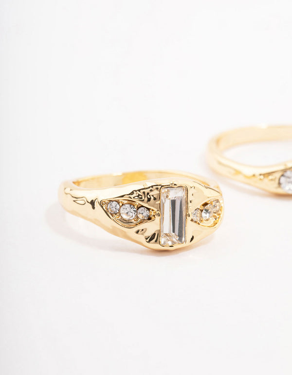 Featuring gold plated baguette signet stacking ring pack with cubic zirconia close up view