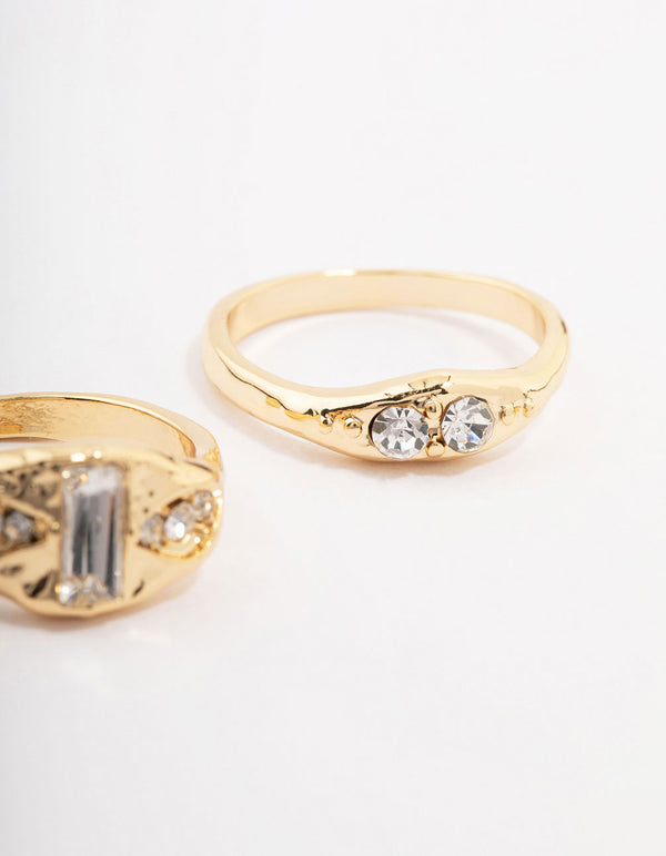 Featuring gold plated baguette signet stacking ring pack with cubic zirconia close up view