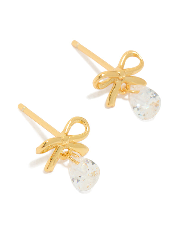Showcasing statement bow earrings with pear cut crystal in gold plated sterling silver front view