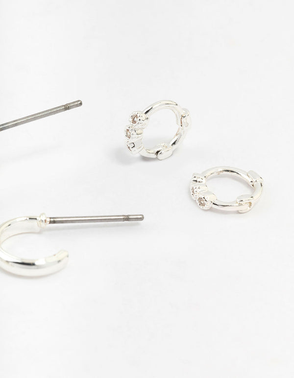 Featuring statement silver mixed diamante huggie hoop earrings in a 3-pack post detail view