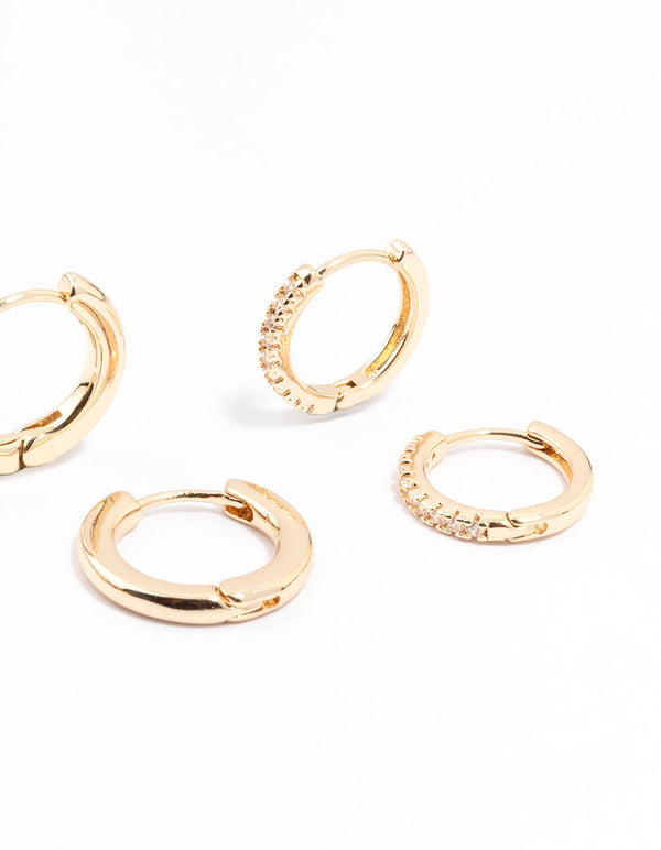 Crafted with gold minimal huggie hoop earrings in a stackable 3-pack post detail view