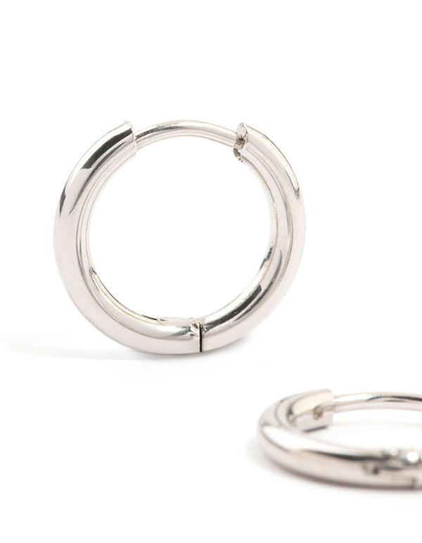 Showcasing waterproof stainless steel core clicker earrings in 14mm chunky style with huggie closure and silver color close up view