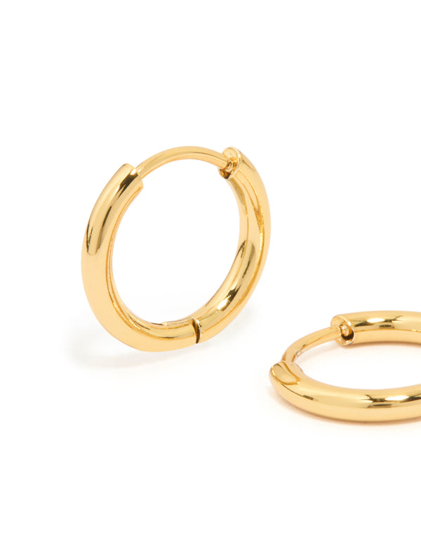 Highlighting waterproof gold plated stainless steel core clicker earrings 14 MM with huggie closure close up view