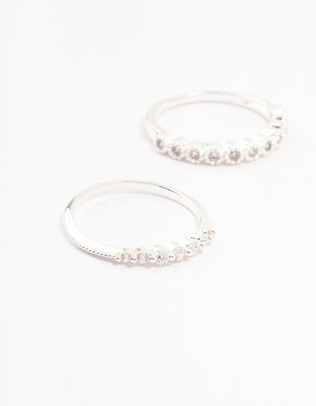 Featuring silver plated fine round cubic zirconia stackable rings in a 3-pack close up view