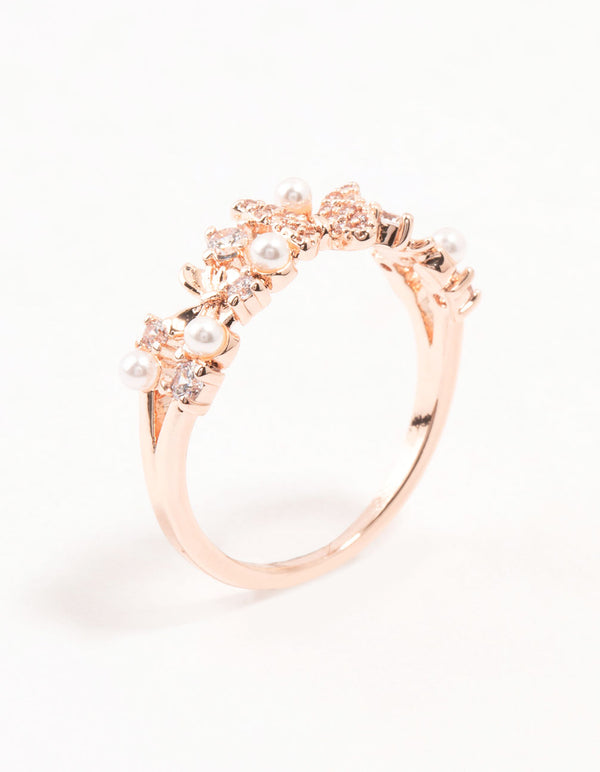 Featuring a rose gold plated butterfly and pearl band ring side detail view