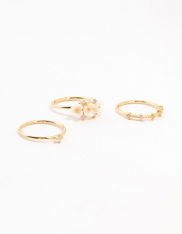 Presenting gold plated triple flower stacking rings in a 3-pack front view
