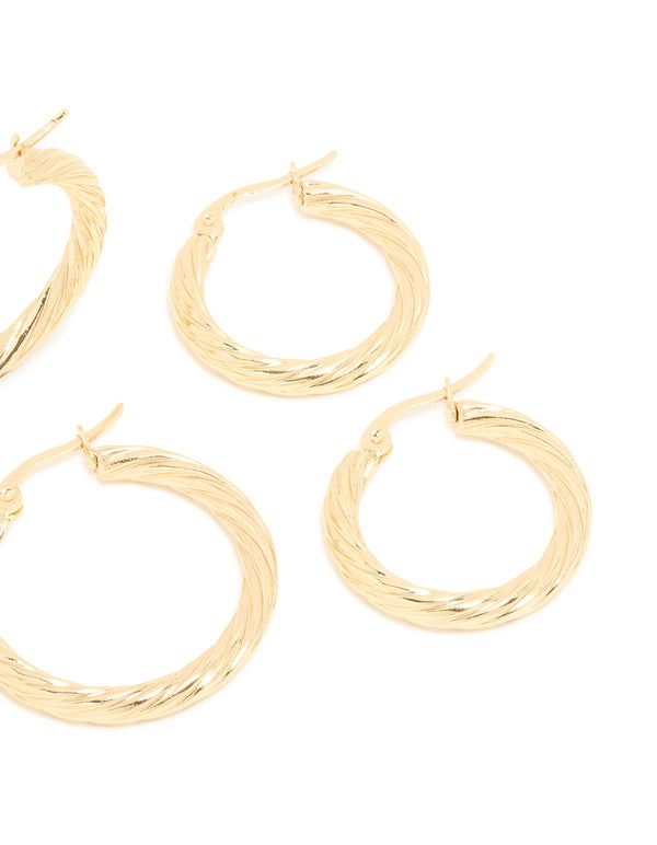 Showcasing waterproof gold plated stainless steel twisted hoop earrings in a 3-pack with textured finish post detail view