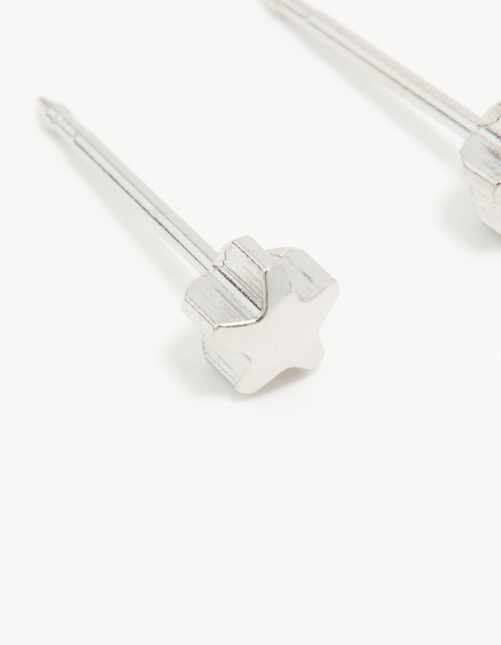 Showcasing surgical stainless steel 4MM piercing studs with celestial star in silver and stud closure close up view