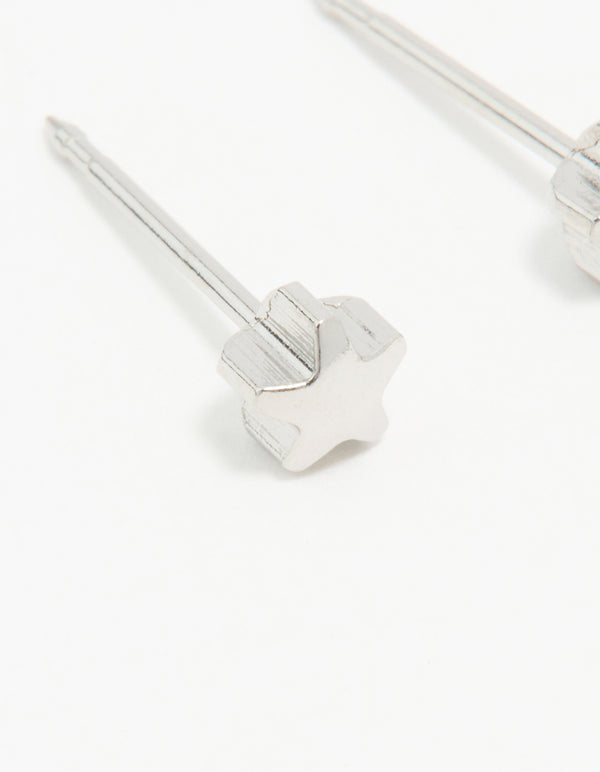 Showcasing surgical stainless steel 4MM piercing studs with celestial star in silver and stud closure close up view