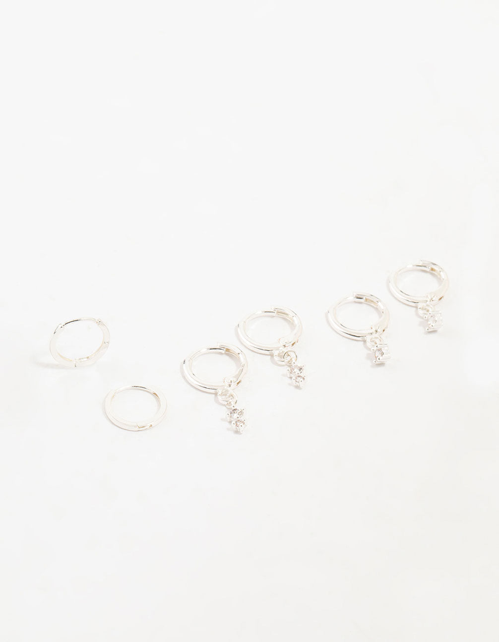 Showcasing dainty charm hoop earrings with cubic zirconia in a 3-pack front view