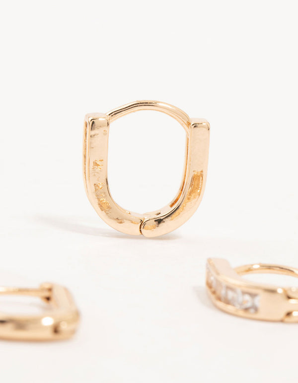 Presenting gold cubic zirconia oval huggie earrings in a 3-pack showcasing stone setting and closure detail view