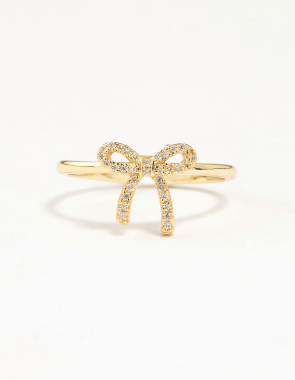Elegantly designed cubic zirconia in gold plated sterling silver ring featuring bow detail close up view