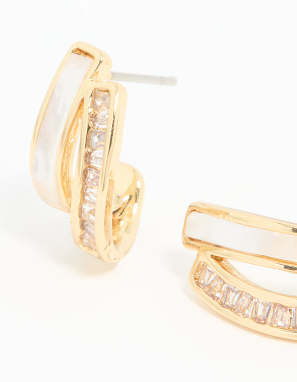 Displaying statement jacket earrings with gold plated cubic zirconia and mother of pearl close up view