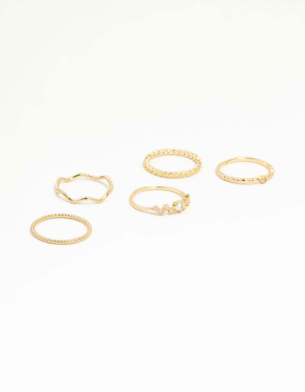 Showcasing a gold plated squiggle and rope rings 5-pack front view