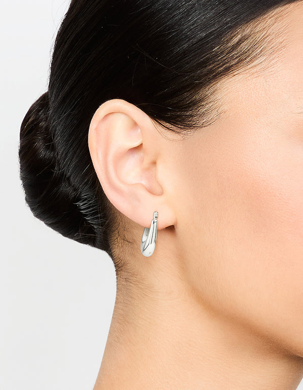 Elegant waterproof stainless steel half hoop earrings with silver finish on ear view