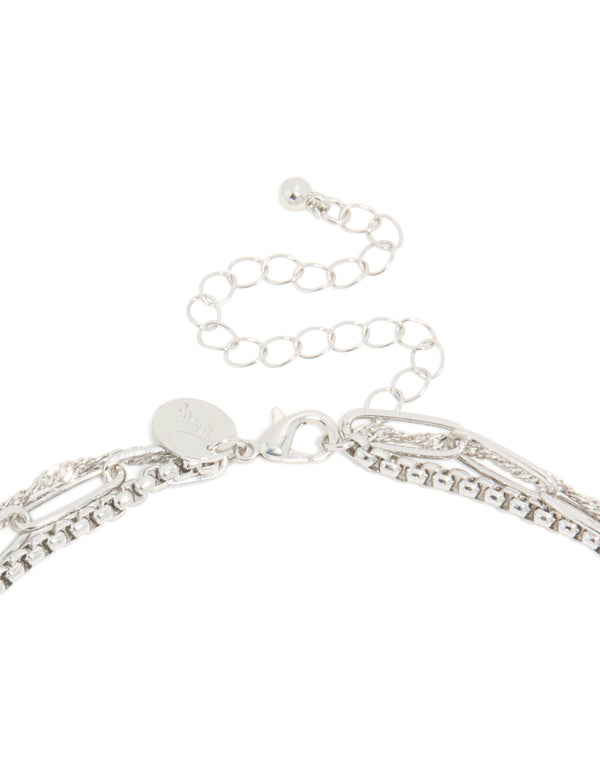 Highlighting a silver diamante cross layered necklace crafted from cubic zirconia with clasp detail view