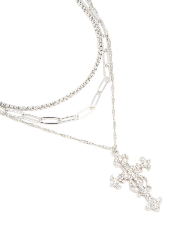 Showcasing a silver diamante cross layered necklace featuring cubic zirconia close up view