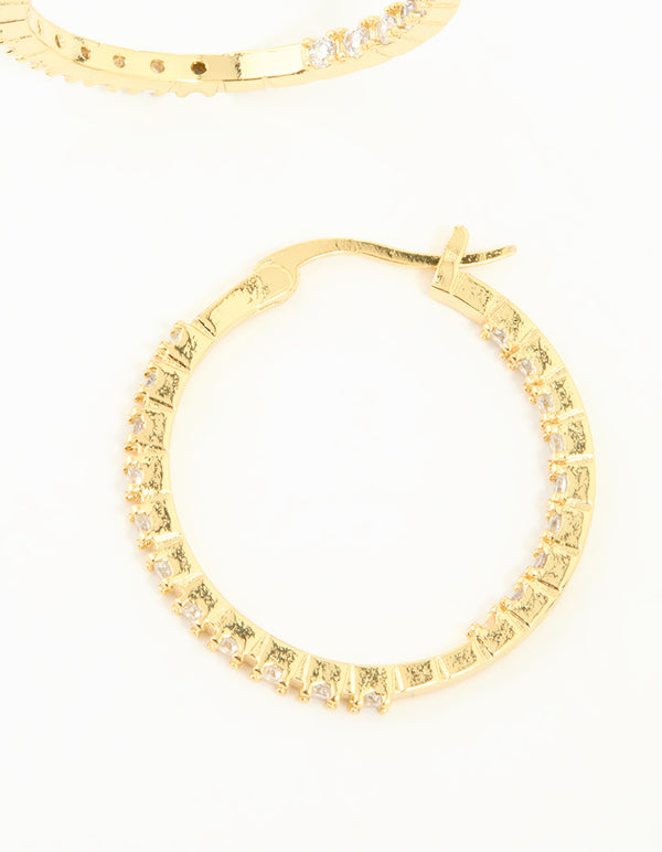 Highlighting the hoop closure mechanism on these gold plated statement large skinny earrings with cubic zirconia post detail view