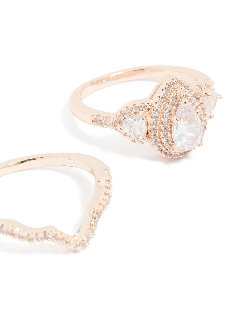 Designed with pearl details, statement style rose gold stacking rings 3-pack close up view