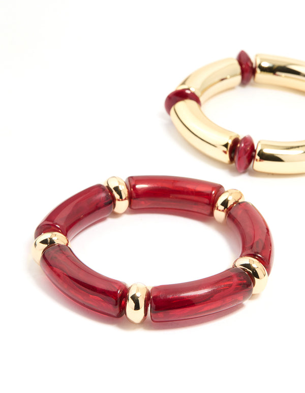 Showcasing beaded stretch bangles in a 3-pack with maroon accents and gold finish close up view