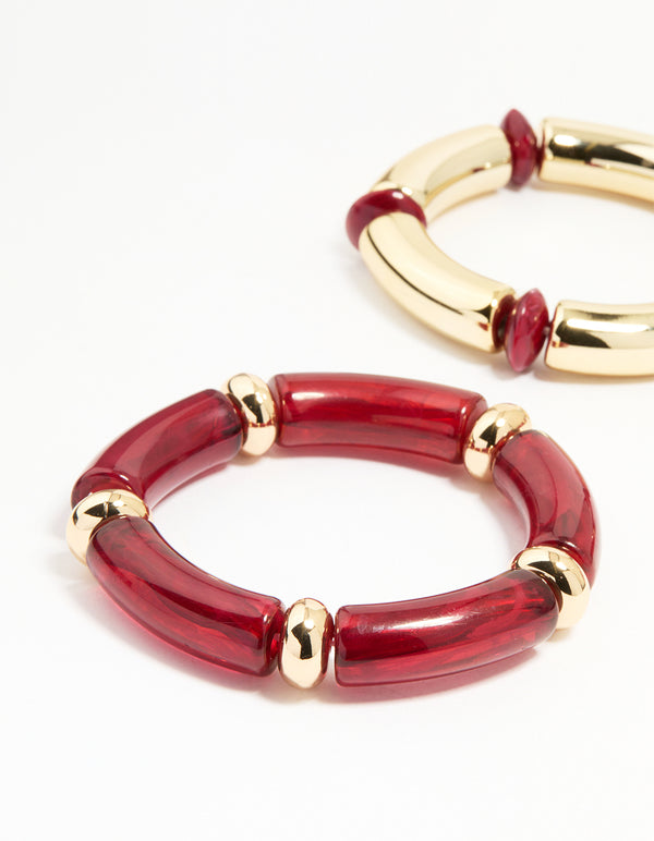 Featuring beaded stretch bangles in a 3-pack with maroon accents and gold finish front view