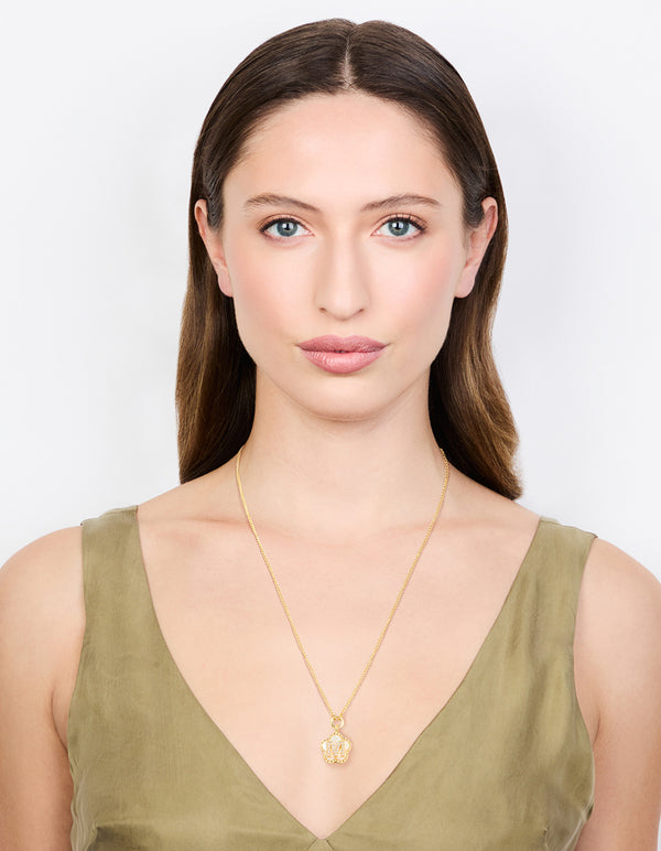 Designed with a gold plated genuine shell letter M flower petal necklace featuring floral, initials cubic zirconia pendant on model view