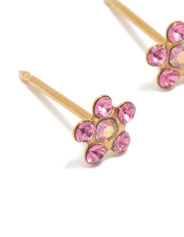 Beautifully detailed 24K gold plated surgical stainless steel pink cubic zirconia daisy piercing stud earrings close up view