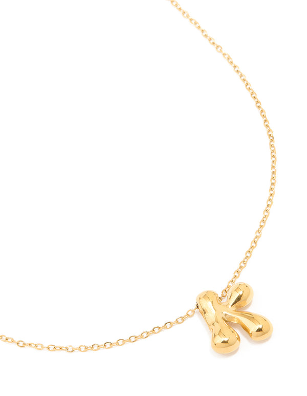 Showcasing a waterproof large bubble letter K dainty necklace crafted from gold plated stainless steel with initial pendant close up view