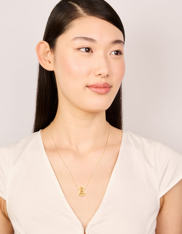 Elegantly worn waterproof gold plated stainless steel large bubble letter B initial pendant necklace on model view