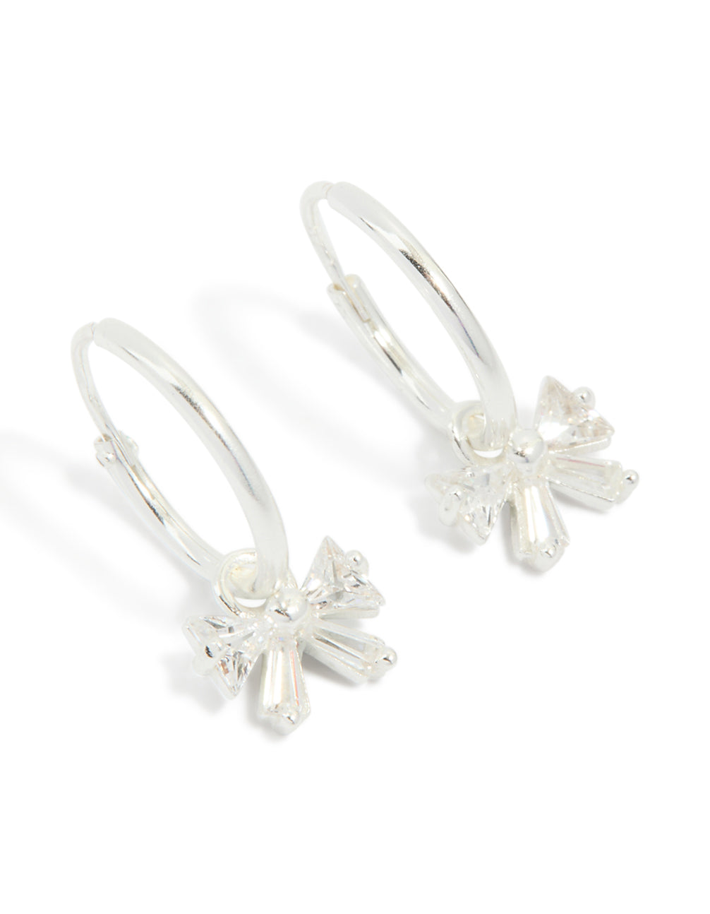Showcasing sterling silver cubic zirconia bow huggie earrings front view