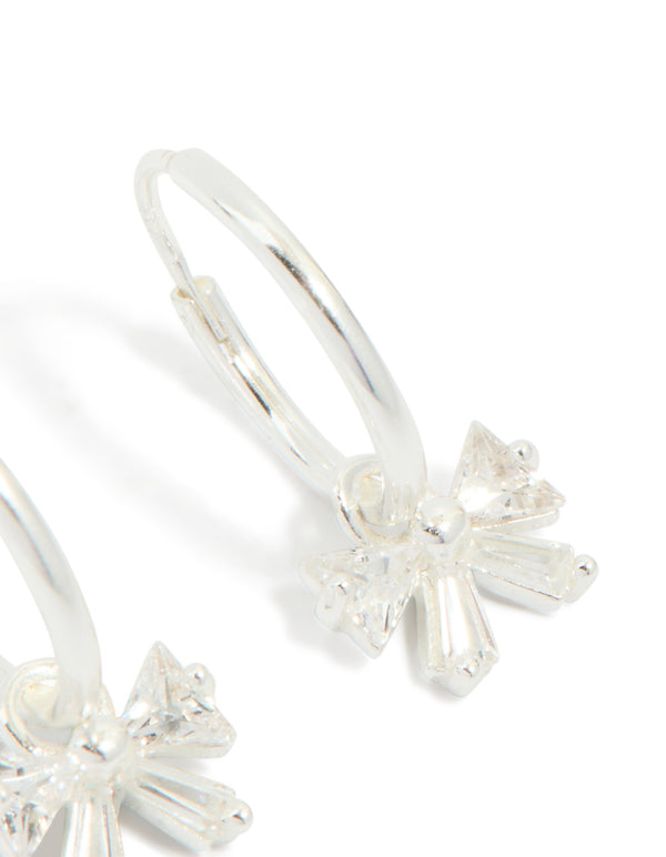 Crafted sterling silver cubic zirconia bow huggie earrings post detail view