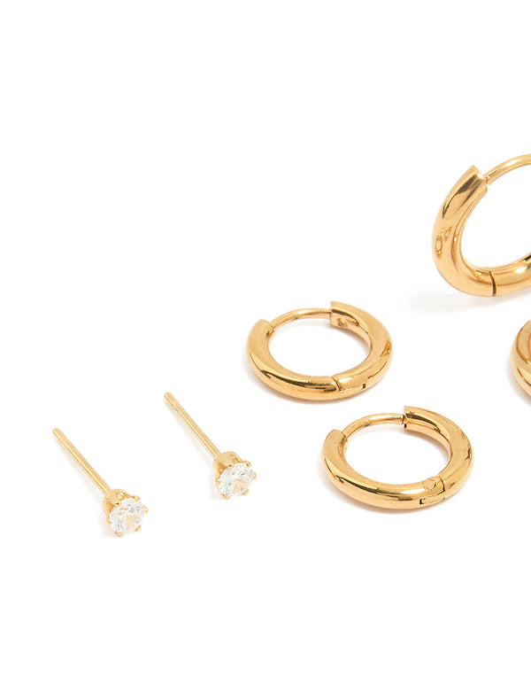 Featuring waterproof gold plated stainless steel cubic zirconia stud earrings in a 4-pack with huggie and crystal details close up view