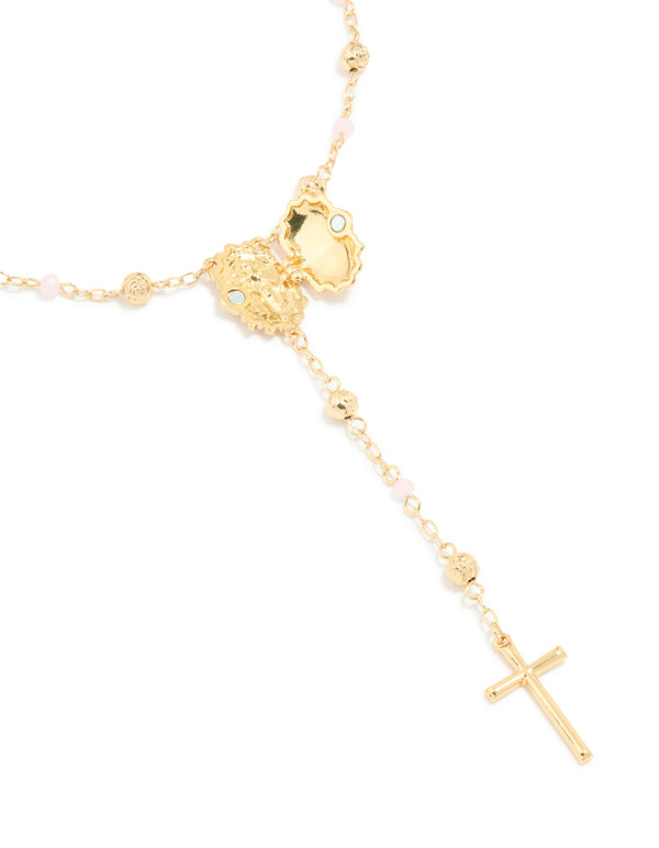 Highlighting a gold plated pink beaded lariat cross necklace crafted with balls, beads clasp detail view