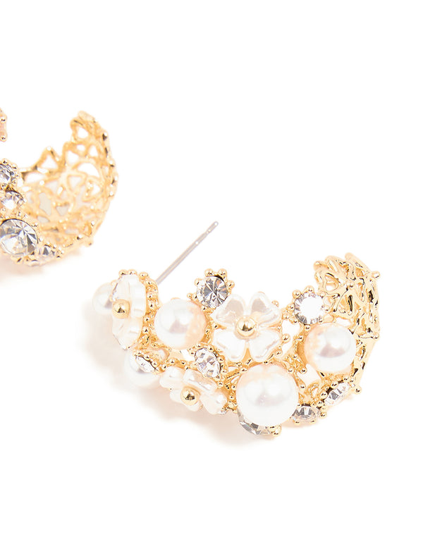 Crafted from gold plated material, flower diamante pearl graduating hoop earrings featuring floral design and hoop closure post detail view