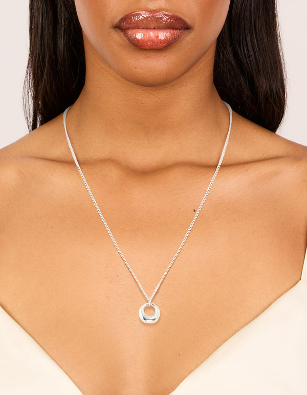 Presenting a waterproof stainless steel bold pendant necklace in silver on neck view