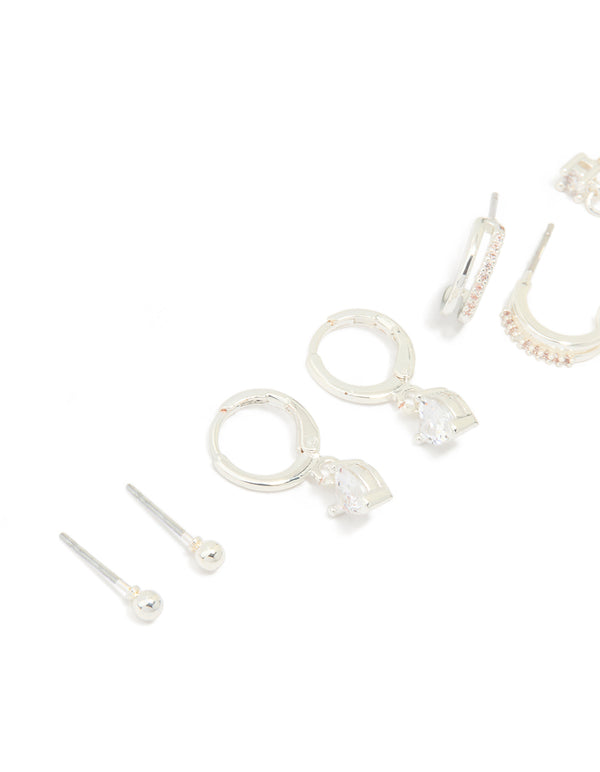 Explore dainty charm heart huggie and stud earrings crafted from silver plated brass featuring cubic zirconia in a 4-pack close up view