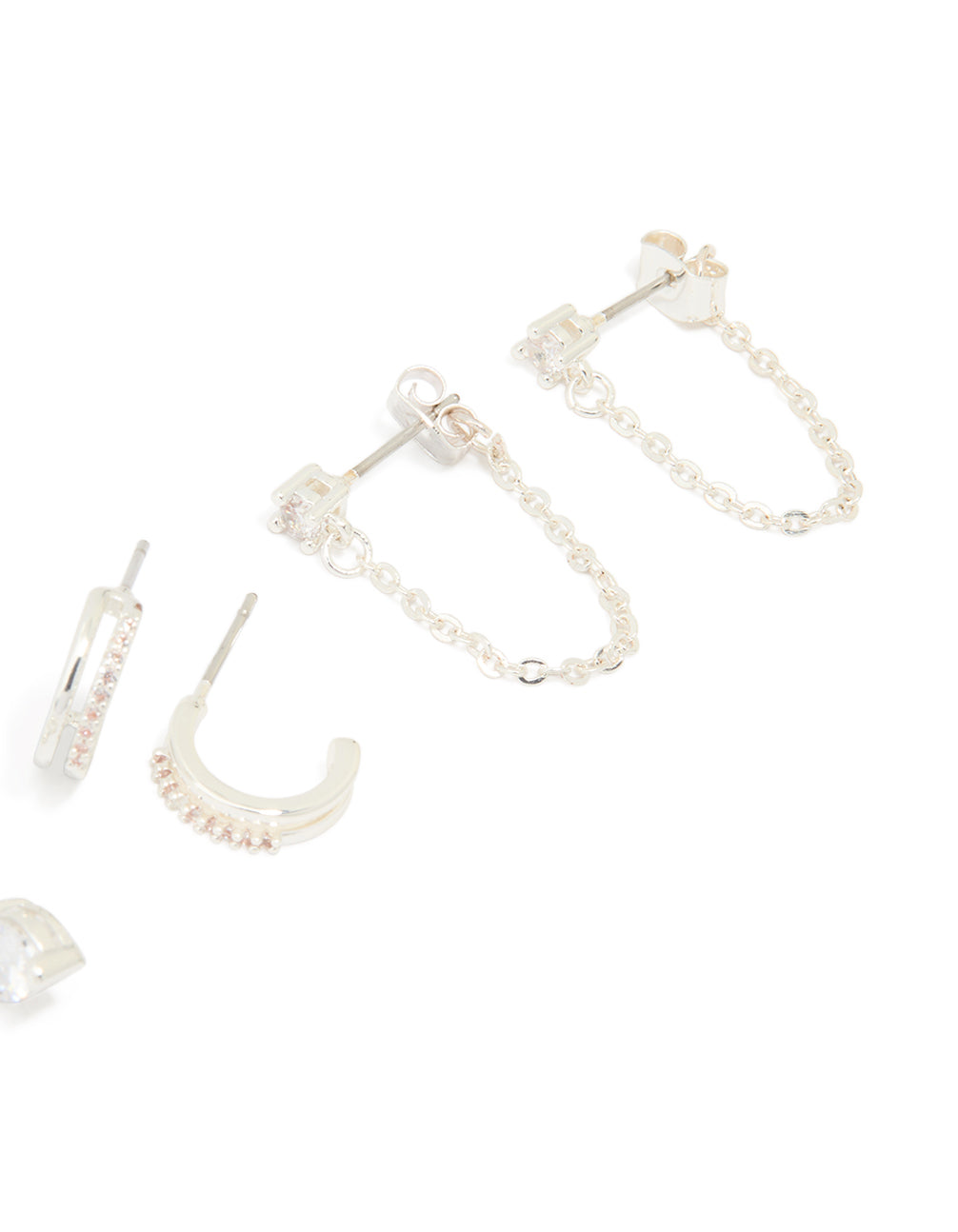 Featuring dainty charm heart huggie and stud earrings in silver plated brass with cubic zirconia 4-pack post detail view