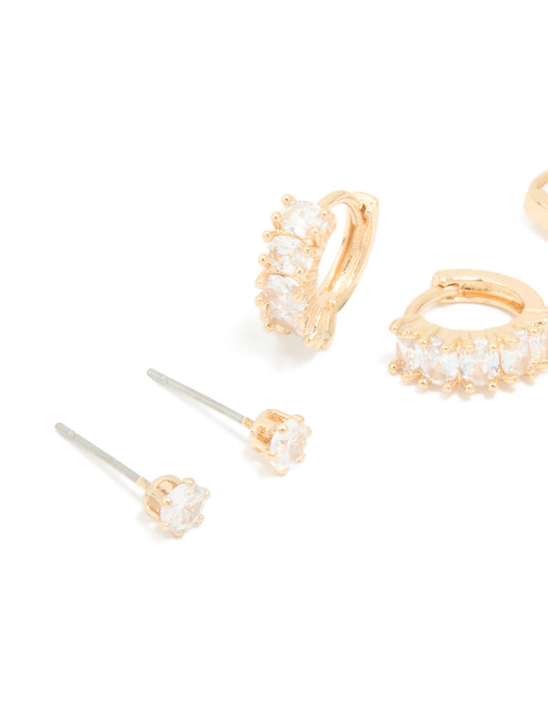 Highlighting gold cubic zirconia hoop and stud earrings 3-pack with huggie closure close up view