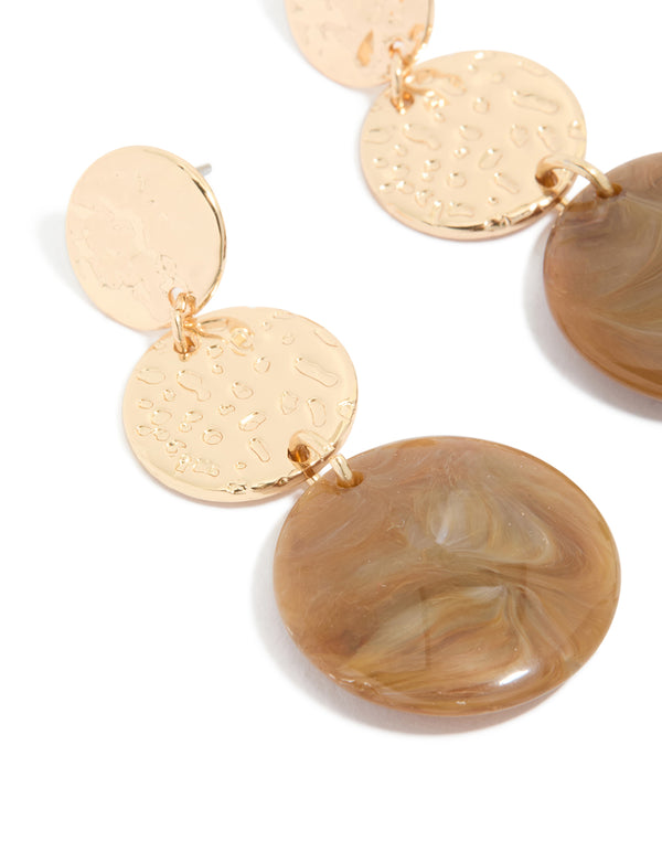 Crafted with gold molten and brown stone round drop earrings featuring statement style close up view