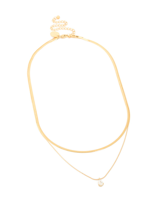 Featuring a waterproof gold plated stainless steel cubic zirconia and snake chain layered necklace in gold close up view