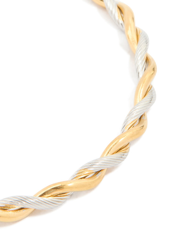 Elegant waterproof twist detail open wrist cuff crafted from gold plated stainless steel in silver tones close up view