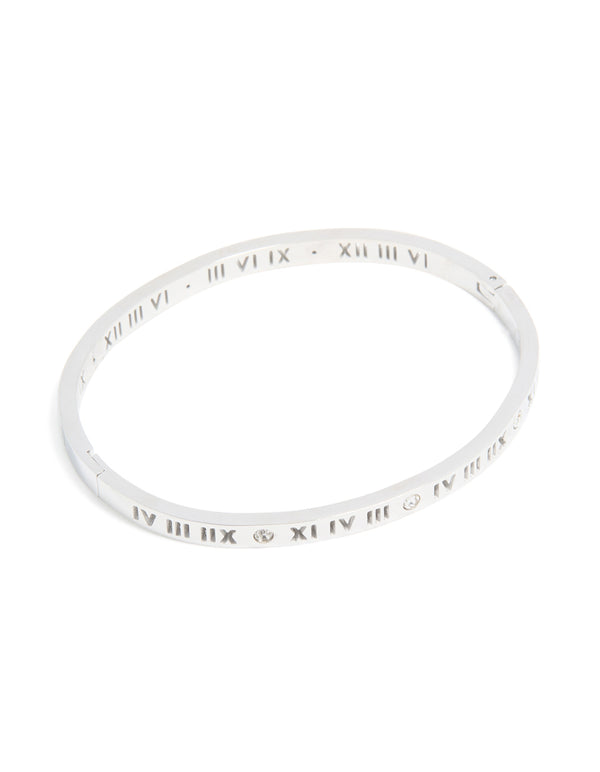 Crafted from waterproof stainless steel, this diamante Roman numeral hinge bangle in silver with clear stones front view
