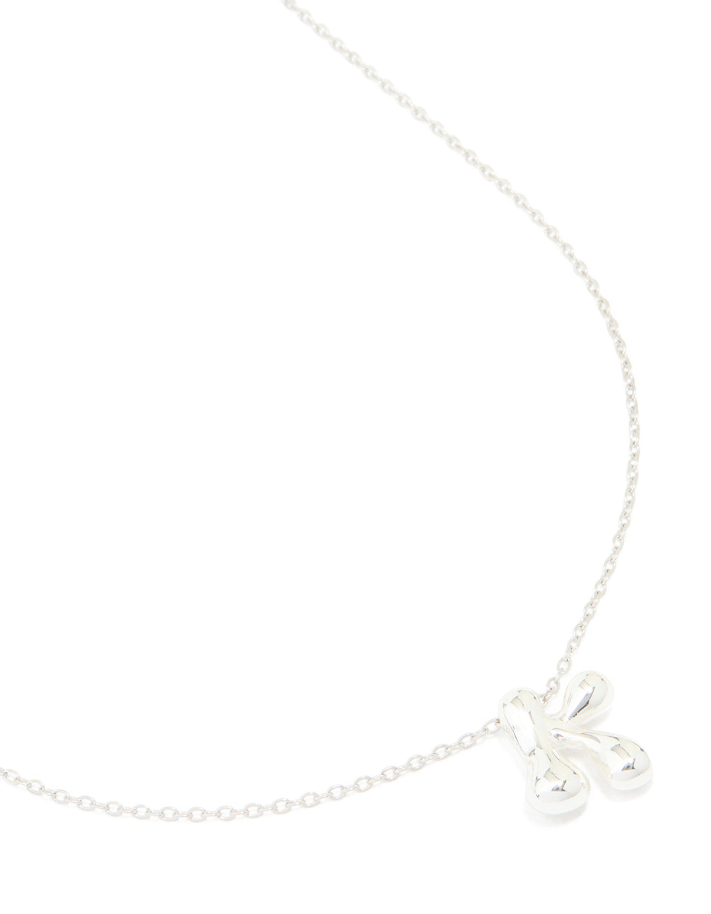 This necklace features a waterproof large bubble letter K initial pendant crafted from stainless steel in silver close up view