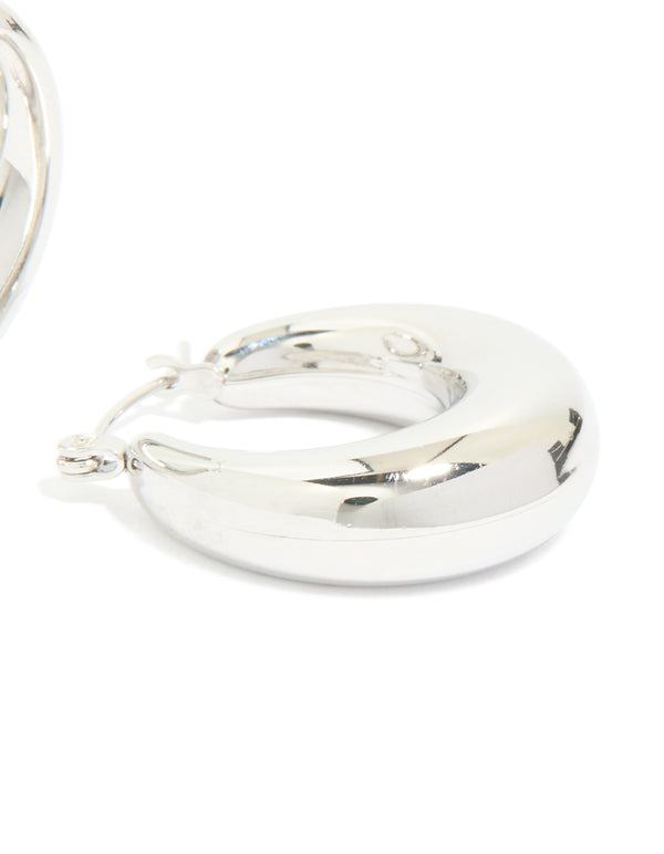 Crafted from waterproof stainless steel small chunky huggie earrings with closure in silver post detail view