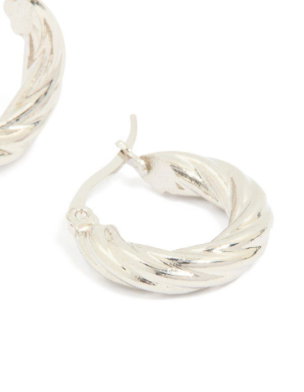 Highlighting waterproof stainless steel twisted hoop earrings in silver close up view